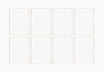 Frame mockup 5x7, 50x70, A4, A3, A2, A1. Set of eight thin light wood frames. Gallery wall mockup, set of 8 frames. Clean, modern, minimalist, bright. Portrait. Vertical. Mat opening 2:3.