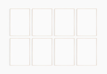 Frame mockup 5x7, 50x70, A4, A3, A2, A1. Set of eight thin light wood frames. Gallery wall mockup, set of 8 frames. Clean, modern, minimalist, bright. Portrait. Vertical.