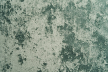 Green fabric background, view from above