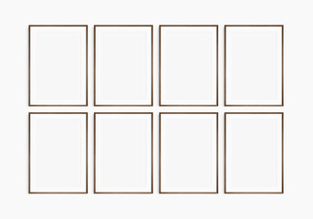 Frame mockup 5x7, 50x70, A4, A3, A2, A1. Set of eight thin dark brown walnut wood frames. Gallery wall mockup, set of 8 frames. Clean, modern, minimalist, bright. Portrait. Vertical. Mat opening 2:3.