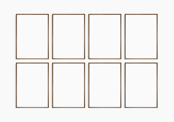Frame mockup 5x7, 50x70, A4, A3, A2, A1. Set of eight thin dark brown walnut wood frames. Gallery wall mockup, set of 8 frames. Clean, modern, minimalist, bright. Portrait. Vertical.