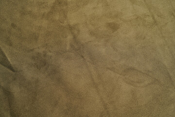 Beige fabric background, view from above