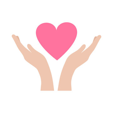 Hands carefully hold the heart. World heart day. The concept of mercy, charity, kindness and love