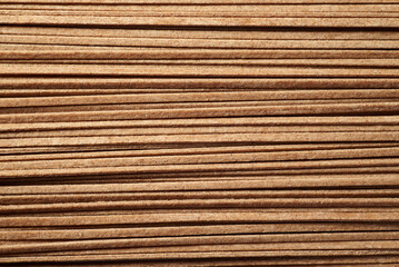 Japaneese buckwheat noodle soba background. Top view macro photo with shallow depth of field.