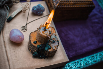 Illustration for esoteric contents, scene with a candle and book of spells , esoteric concept,...