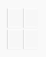 Frame mockup 5x7, 50x70, A4, A3, A2, A1. Set of four thin white frames. Gallery wall mockup, set of 4 frames. Clean, modern, minimalist, bright. Portrait. Vertical. Mat opening 2:3.