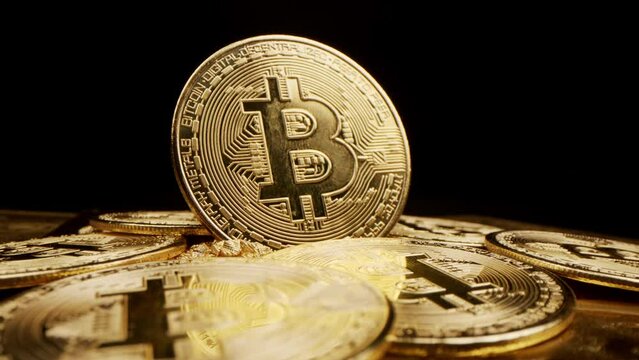 Bitcoin Crypto currency Gold Bitcoin BTC Bit Coin close up of Bitcoin coins isolated on black background Blockchain technology, bitcoin mining concept 3d rendering

