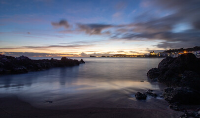 Fototapeta na wymiar Sunset at island, Portugal travel destination, long exposure with soft colors.