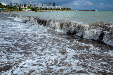 sea storm on sand beach 