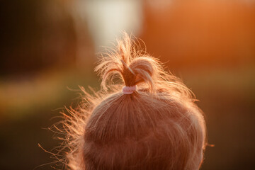 Rear View Of A Girl During An Active Camping Trip Walking Along A Rural Path