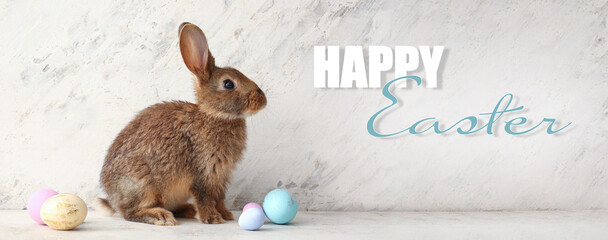 Beautiful greeting card for Happy Easter with cute rabbit and eggs