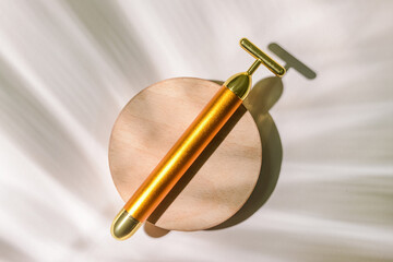 Face massage roller on light background