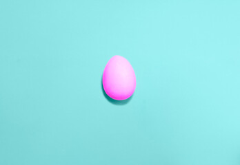 Easter eggs colored with violet color on a blue background. Flat lay. Copy space for text, mock up. Banner. 