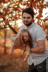 Fototapeta premium Family traditions. Father's day with his daughter at home. A handsome father with a little girl. Happy father and daughter. a little girl loves her daddy. happy Father's Day.Father's Day. 
