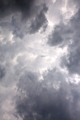 Fototapeta na wymiar Dark ominous grey storm clouds. Dramatic sky.
