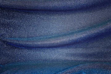 Naklejka premium background of beautiful dark blue glitter fabric