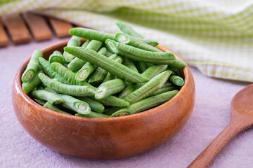 Yard long bean in wooden bowl