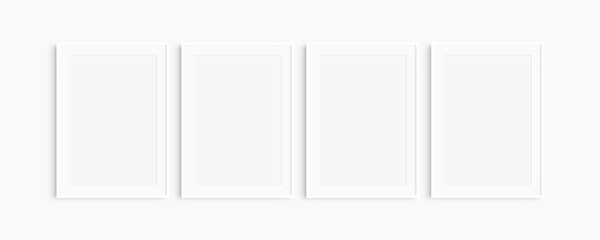 Frame mockup 5x7, 50x70, A4, A3, A2, A1. Set of four thin white frames. Gallery wall mockup, set of 4 frames. Clean, modern, minimalist, bright. Portrait. Vertical. Mat opening 2:3.
