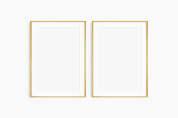 Frame mockup 5x7, 50x70, A4, A3, A2, A1. Set of two thin oak wood frames. Gallery wall mockup, set of 2 frames. Clean, modern, minimalist, bright. Portrait. Vertical. Mat opening 2:3.