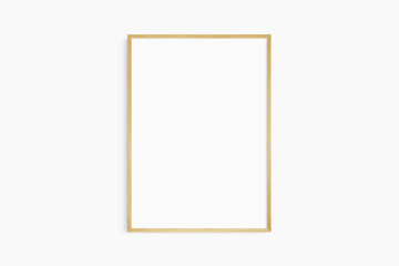 Obraz premium Frame mockup 5x7, 50x70, A4, A3, A2, A1. Single oak wood frame mockup. Clean, modern, minimalist, bright. Portrait. Vertical.