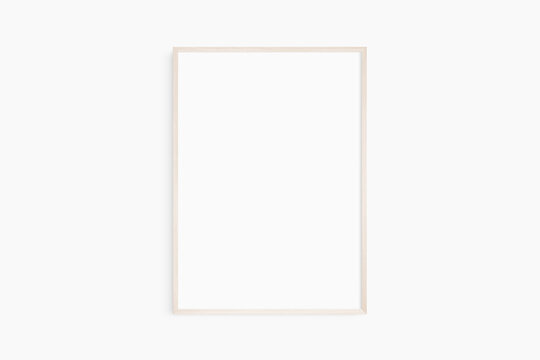 Frame mockup 5x7, 50x70, A4, A3, A2, A1. Single light wood frame mockup. Clean, modern, minimalist, bright. Portrait. Vertical.