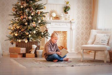 portrait of a boy in a bright New Year's interior