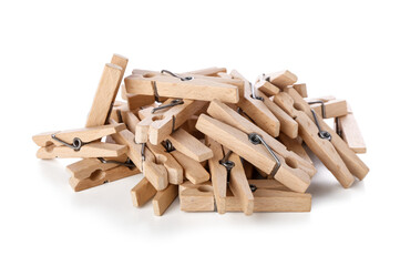 Heap of wooden clothespin on white background