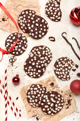 Tasty cookies with white chocolate chips on light background
