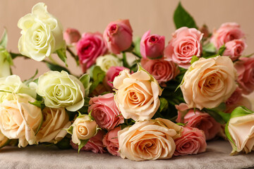 Bouquet of beautiful roses on table, closeup