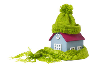 House in a Warm Knitted Green Cap and a Scarf - 483749406