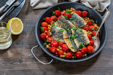 Sardines with chickpeas, cherry tomatoes, lemon and parsley