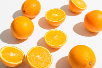 Fresh ripe cut oranges on white background, closeup