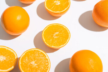 Fresh ripe cut oranges on white background, closeup