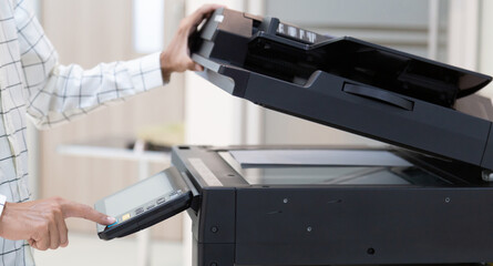 Bussinessman press button on panel of printer photocopier  network , Working on photocopies in the office concept , printer is office worker tool equipment for scanning and copy paper.