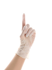 Woman in medical glove pointing at something on white background