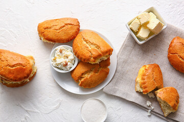 Plate of tasty sochniki with cottage cheese on white background