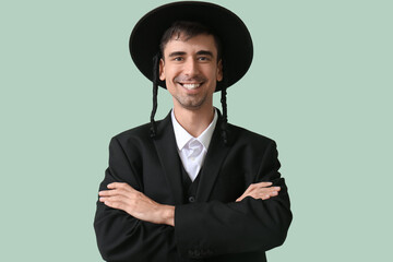 Hasidic Jewish man on color background