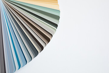 Paper color sample palette catalogue for paints on white background. Pastel tones and different shades of brown, green, blue and grey. Copy space. RGB and CMYK.