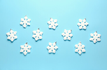 Stylish snowflakes on blue background