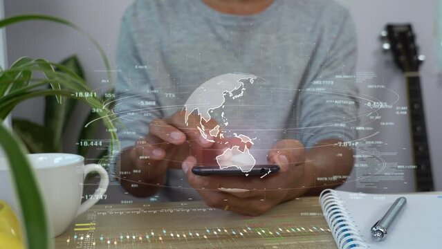 A man using smart phone analysis business data hologram. business growth concept.