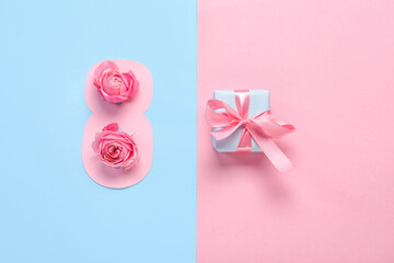 Paper figure 8 with rose flowers and gift box on color background