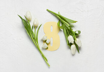 Composition with beautiful flowers and paper figure 8 on light background