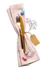 Stylish cutlery for Easter celebration on white background