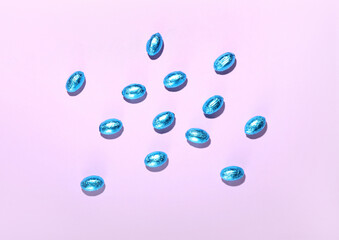 Chocolate Easter eggs on purple background