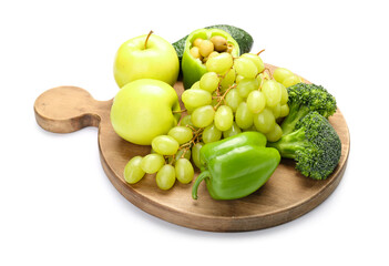 Wooden board with different vegetables and fruits for St. Patrick's Day celebration on white background