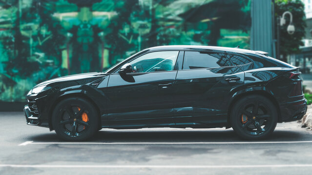 Lamborghini Urus Super SUV In Parking Slot, Side View