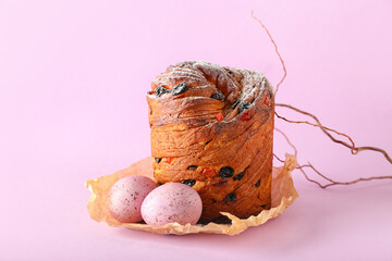 Delicious Easter cake and eggs on pink background