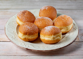 Austrian and german donuts - krapfen.  Berliner with cream. On white table. Selective focus.