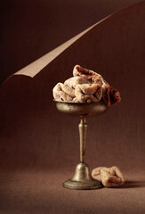 Dried figs on a brown background.