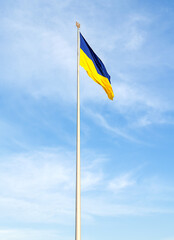 The flag of Ukraine is blown by the wind
